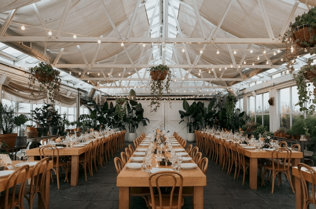 Evening dinner reception in The Greenhouse at Audrey's Farmhouse wedding venue. 